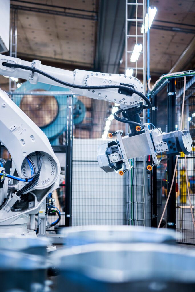 Industrial robotic arm in a manufacturing facility.